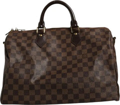 Brown checkered handbag with visible brand logo on a white background
